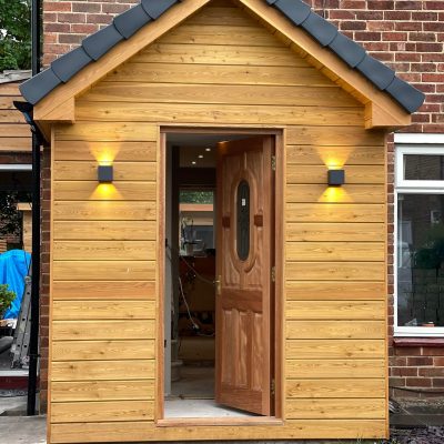Timber-clad porch with horizontal cladding boards