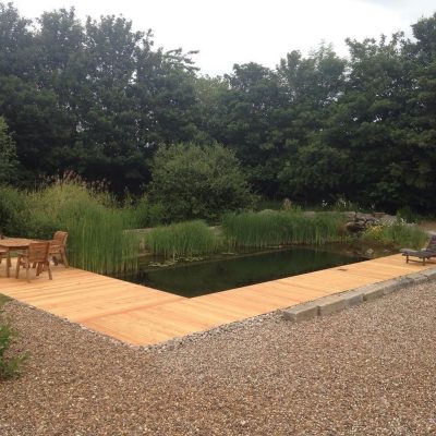 Timber decking around a natural swimming pond
