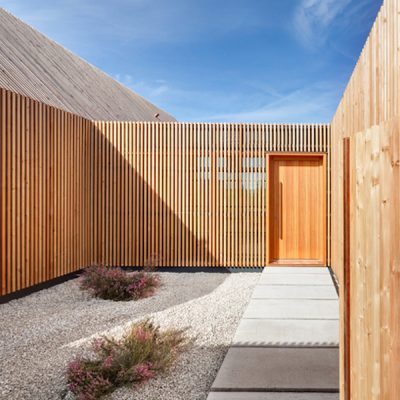Vertical timber cladding around a courtyard