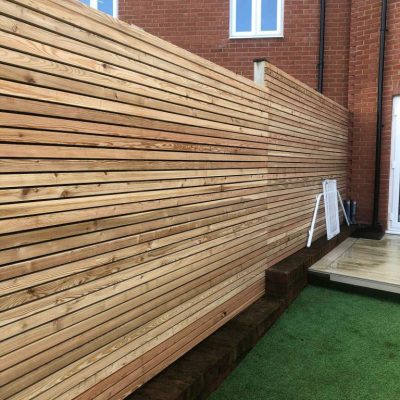 Horizontal slatted timber screen fence